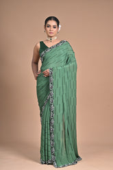 “Emerald Grace” – Minimalist Green Saree with Floral Lace Border
