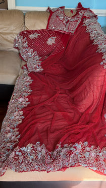 Net saree with heavy embroidered blouse and border