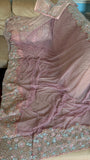Net saree with heavy embroidered blouse and border