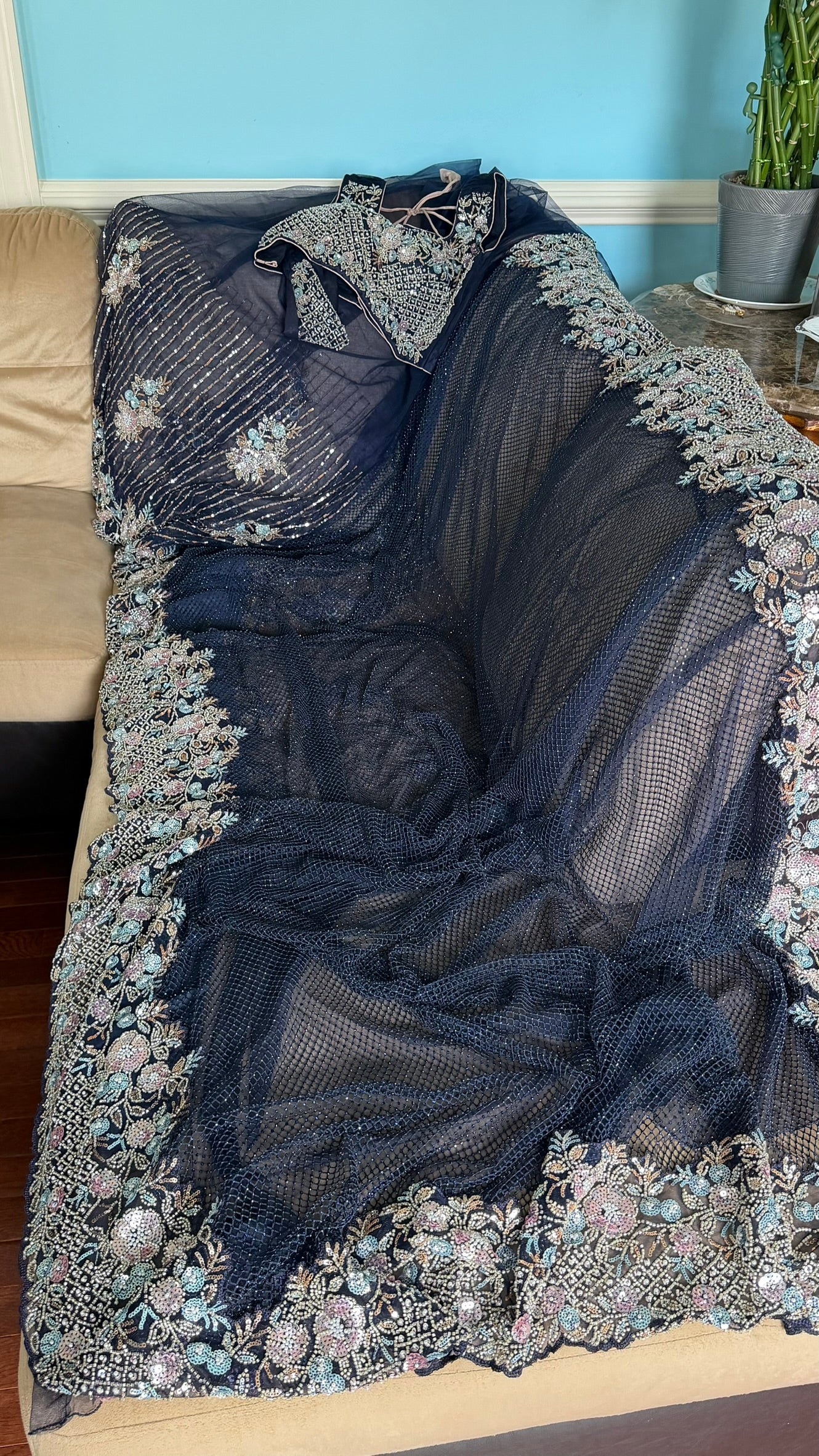 Net saree with heavy embroidered blouse and border