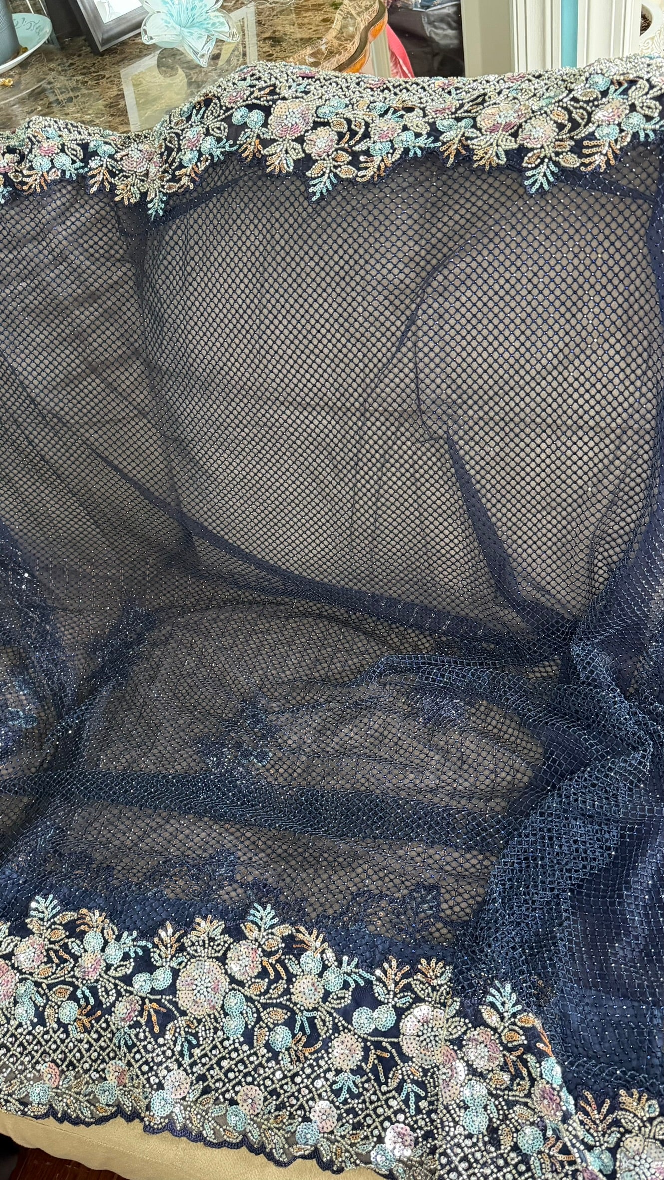 Net saree with heavy embroidered blouse and border
