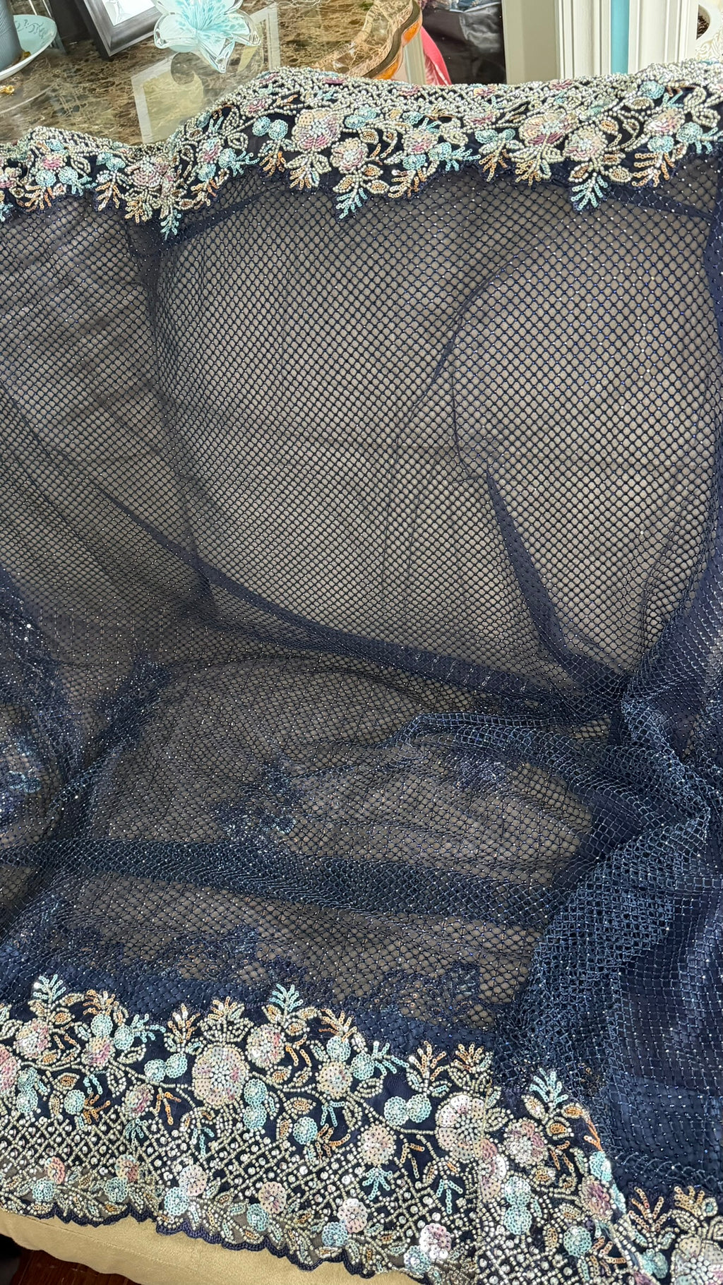 Net saree with heavy embroidered blouse and border