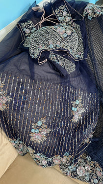 Net saree with heavy embroidered blouse and border