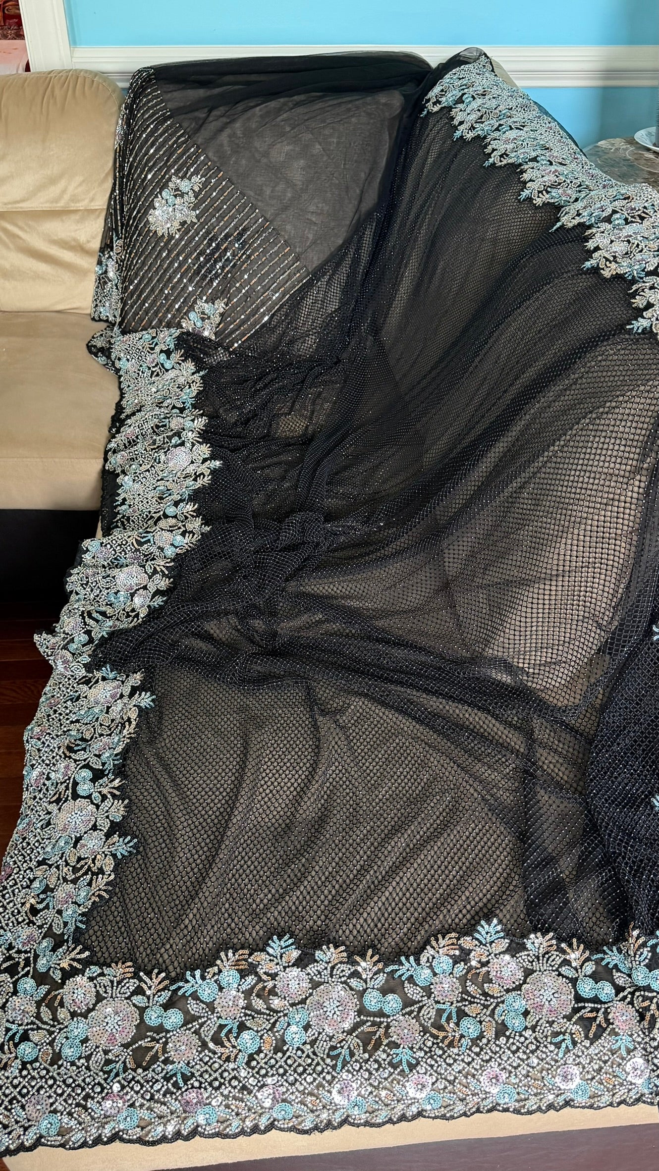 Net saree with heavy embroidered blouse and border