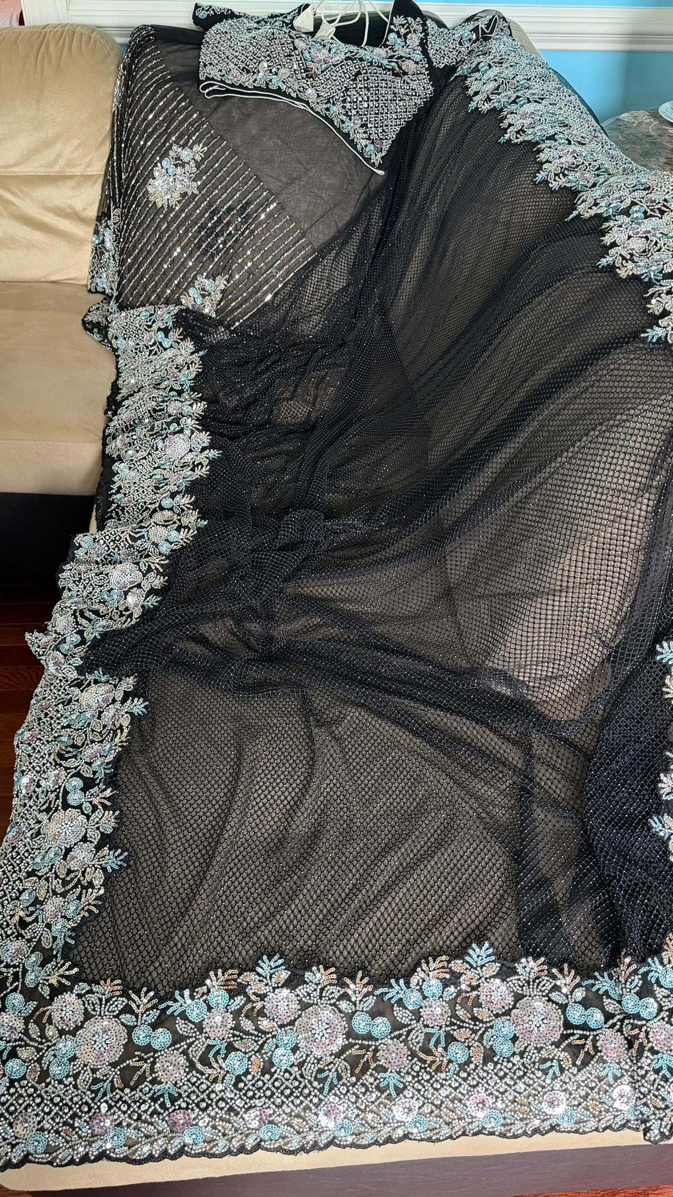 Net saree with heavy embroidered blouse and border