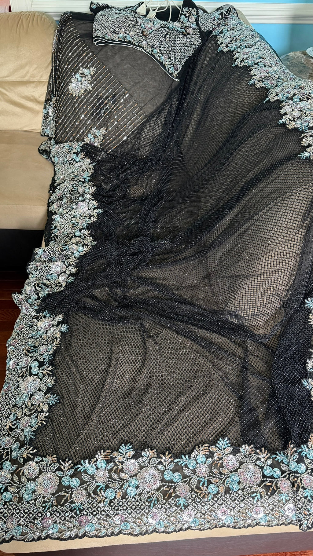 Net saree with heavy embroidered blouse and border