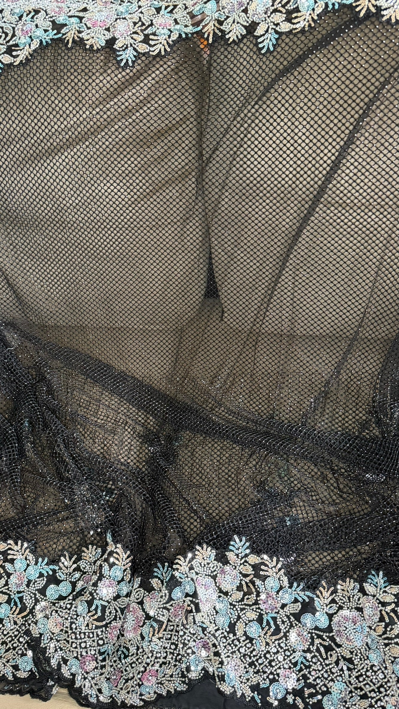Net saree with heavy embroidered blouse and border