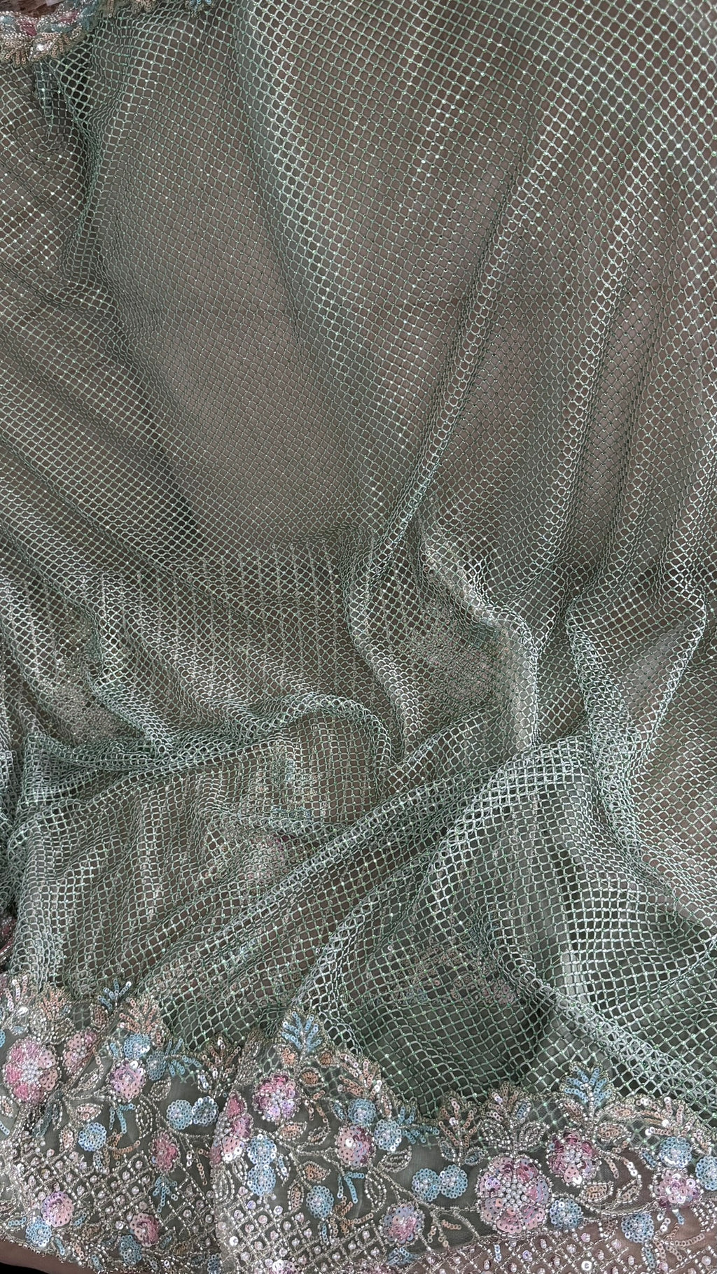 Net saree with heavy embroidered blouse and border