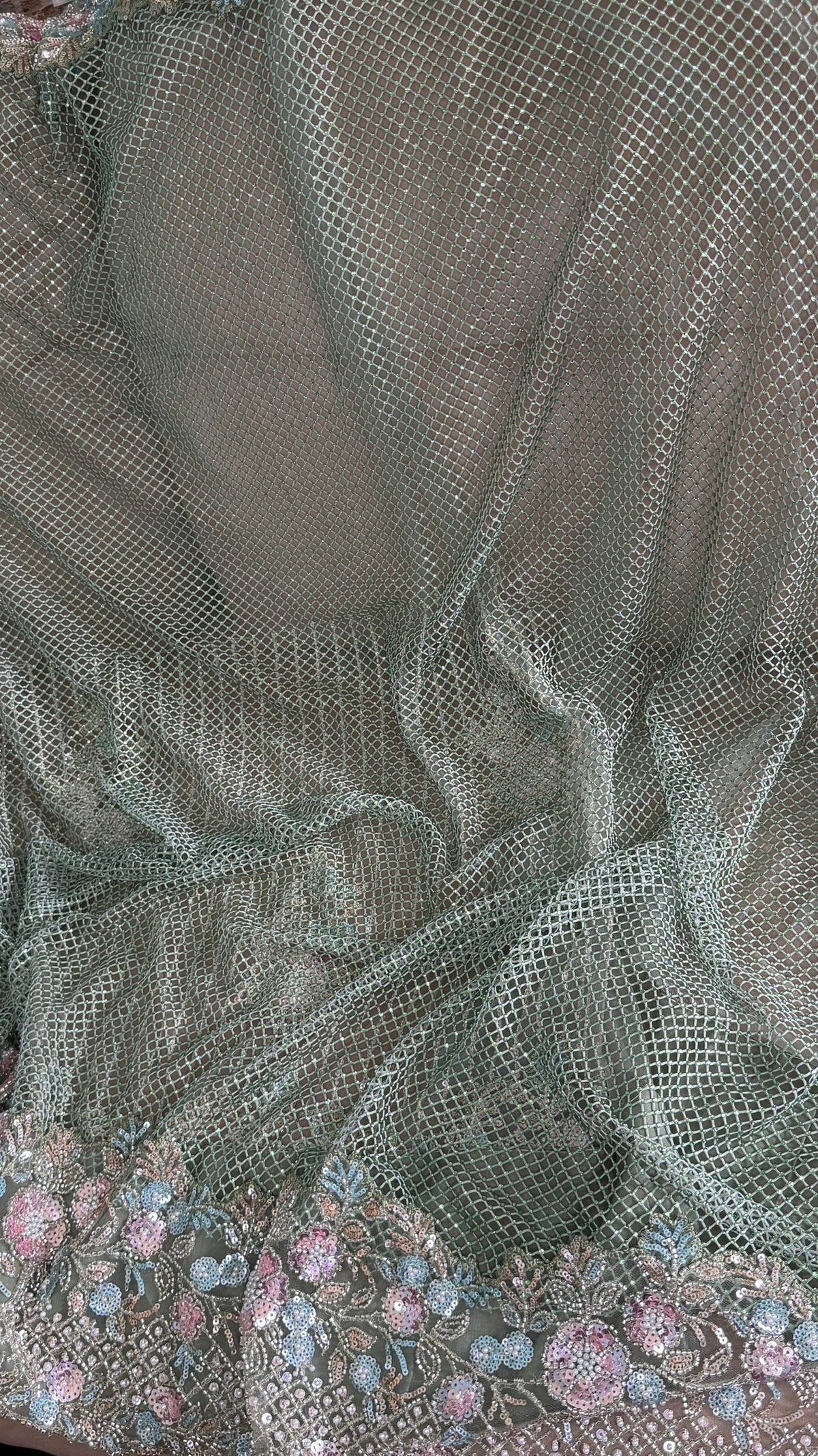 Net saree with heavy embroidered blouse and border