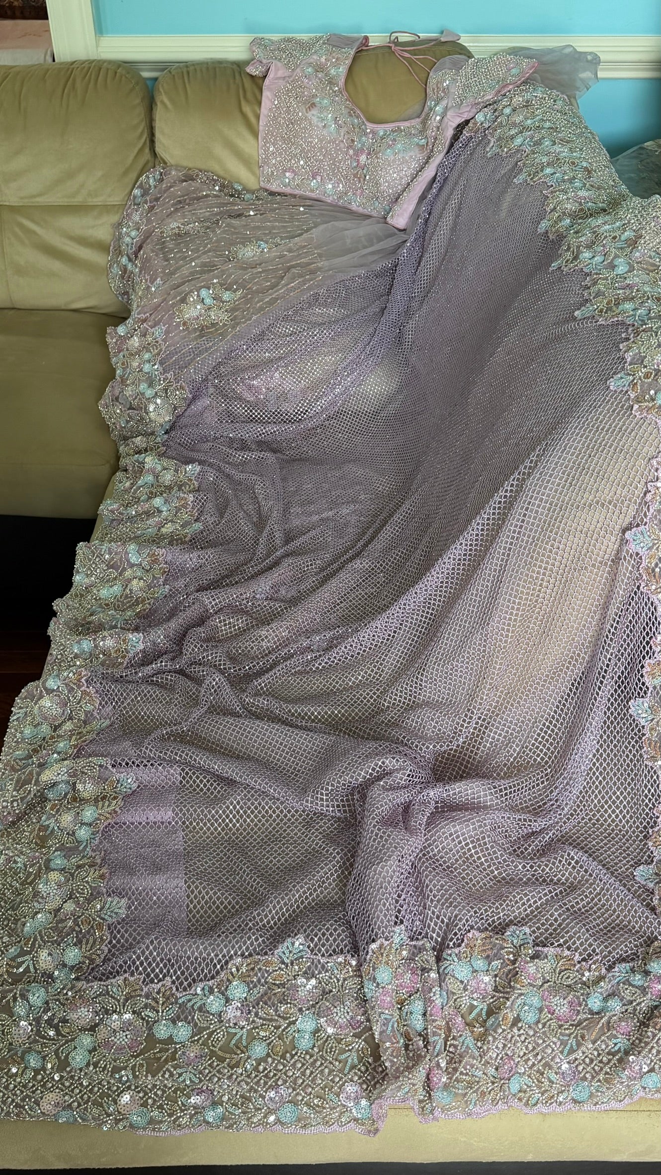 Net saree with heavy embroidered blouse and border