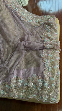Net saree with heavy embroidered blouse and border
