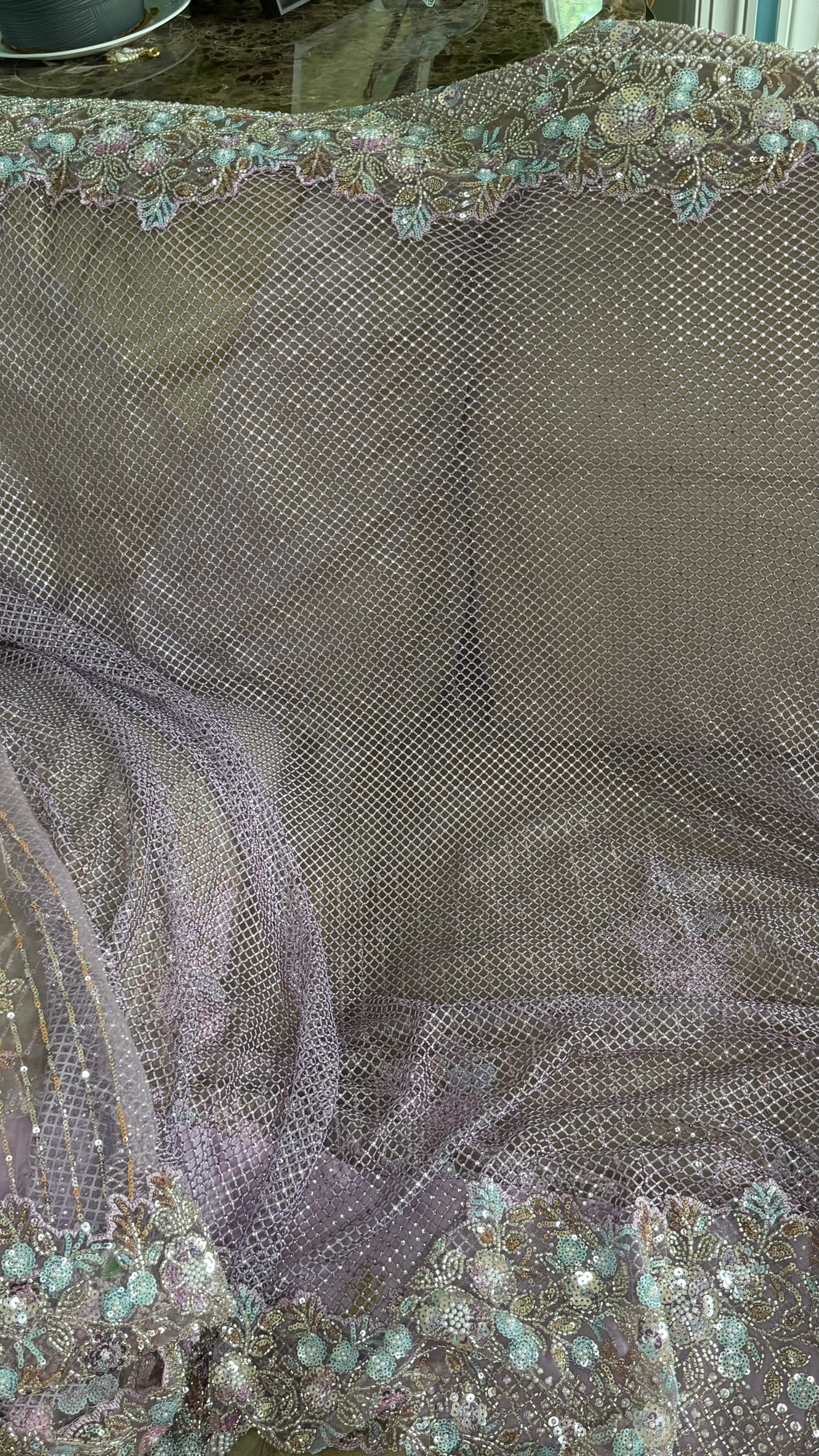 Net saree with heavy embroidered blouse and border
