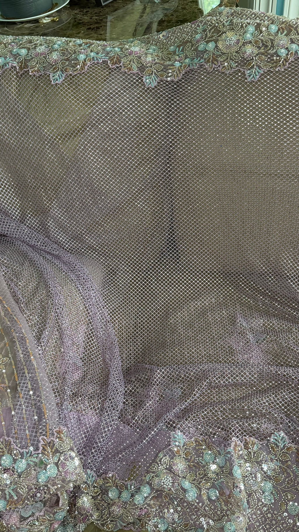Net saree with heavy embroidered blouse and border