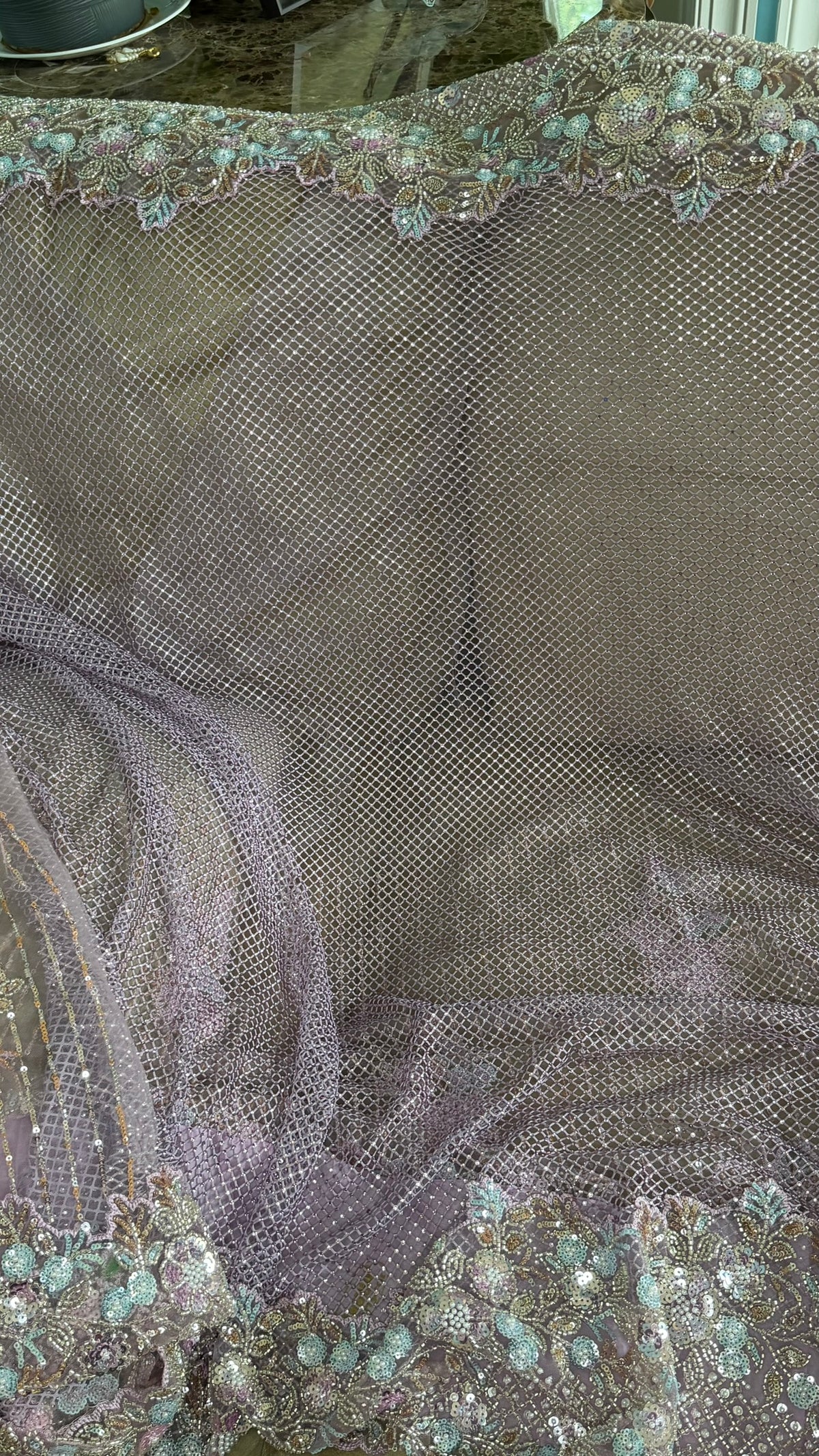Net saree with heavy embroidered blouse and border