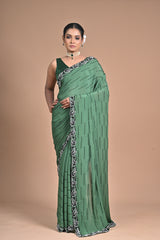 “Emerald Grace” – Minimalist Green Saree with Floral Lace Border