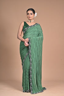 “Emerald Grace” – Minimalist Green Saree with Floral Lace Border