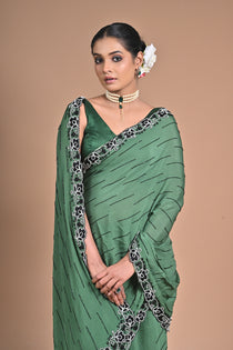 “Emerald Grace” – Minimalist Green Saree with Floral Lace Border