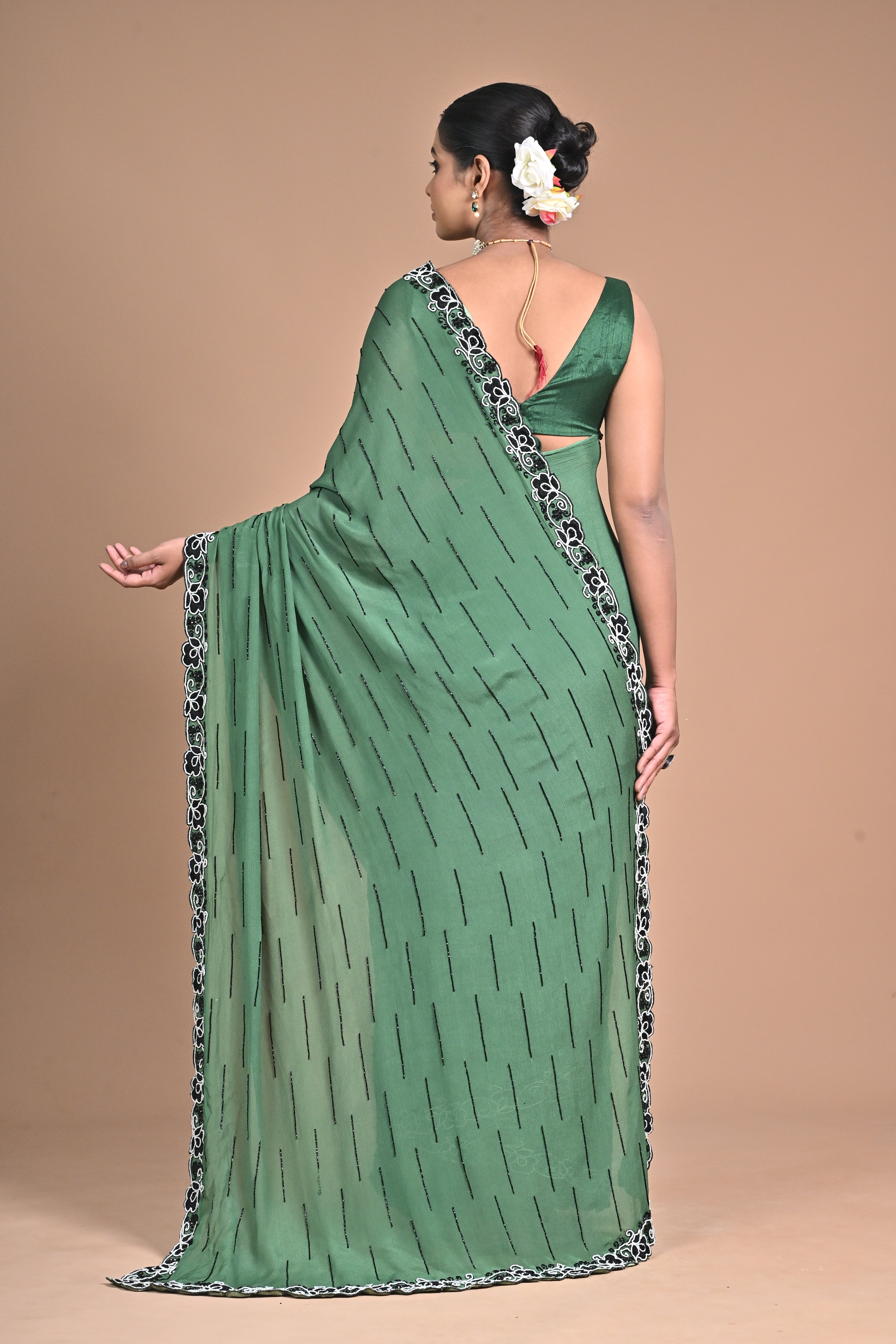 “Emerald Grace” – Minimalist Green Saree with Floral Lace Border