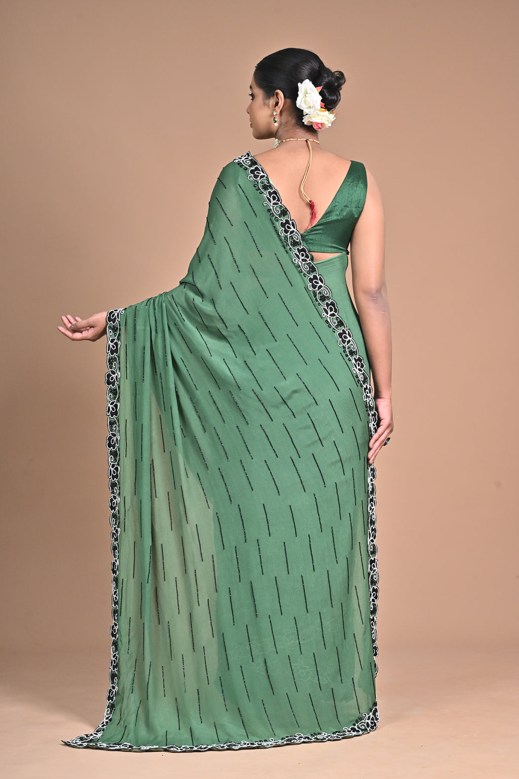 “Emerald Grace” – Minimalist Green Saree with Floral Lace Border