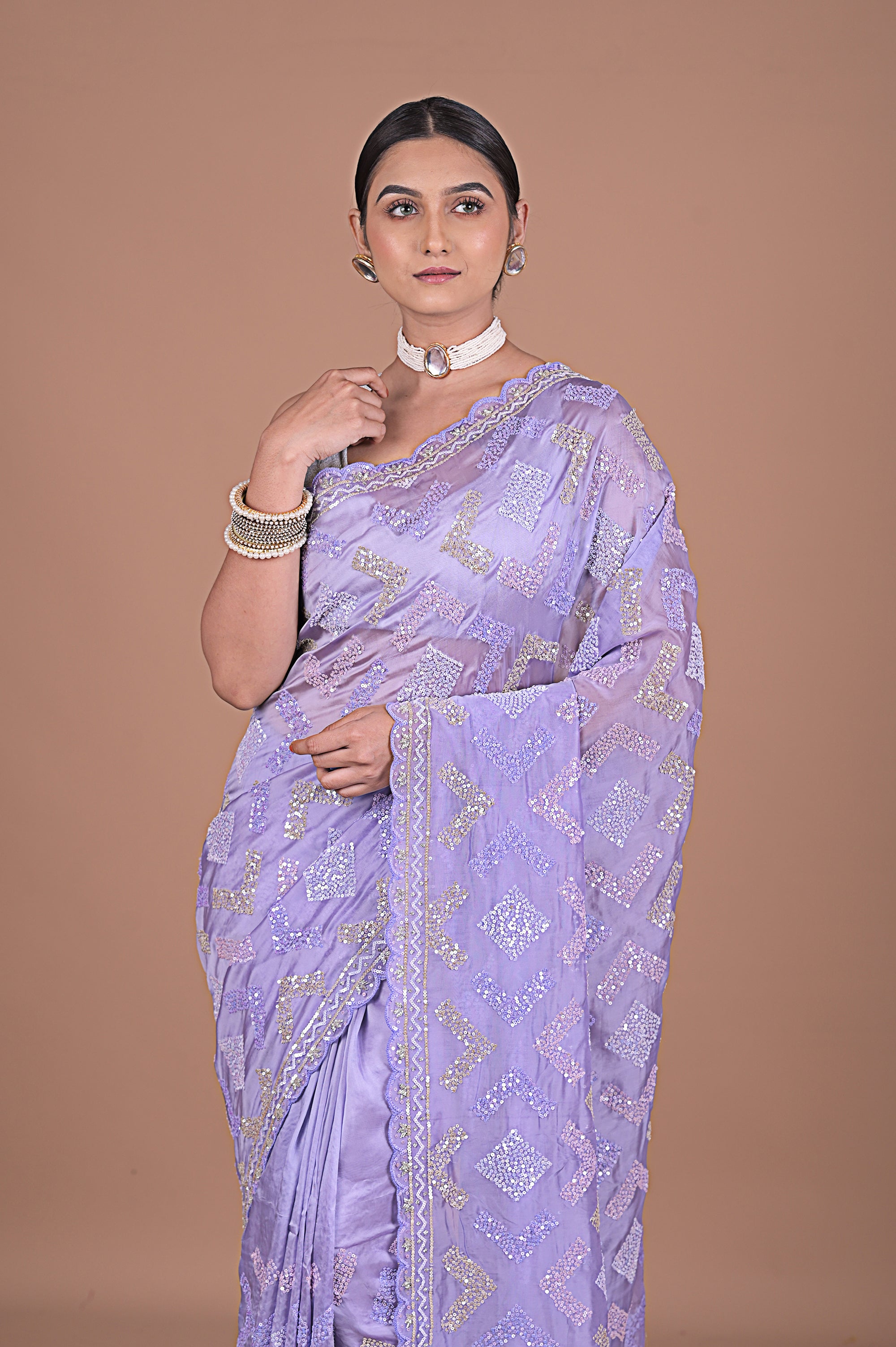 Sequence embroidered on satin organza