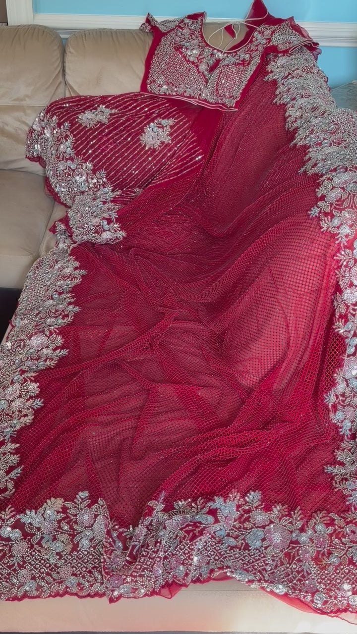 Net saree with heavy embroidered blouse and border