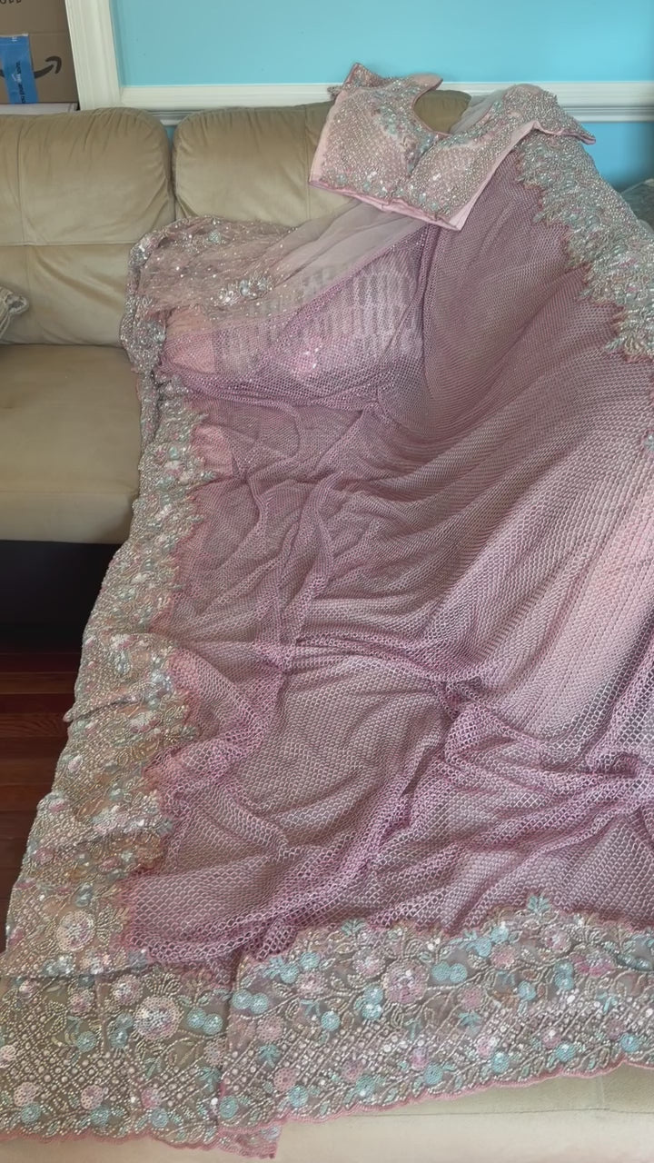 Net saree with heavy embroidered blouse and border