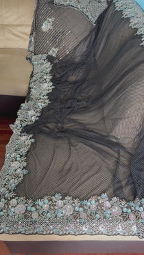 Net saree with heavy embroidered blouse and border